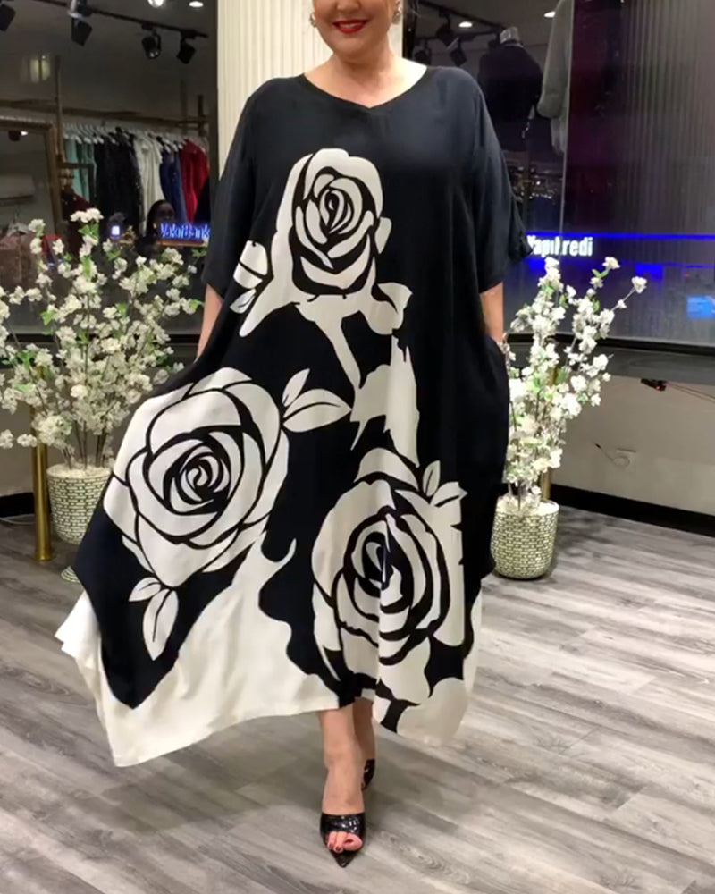 Zwarte jurk met rozenprint elegant design