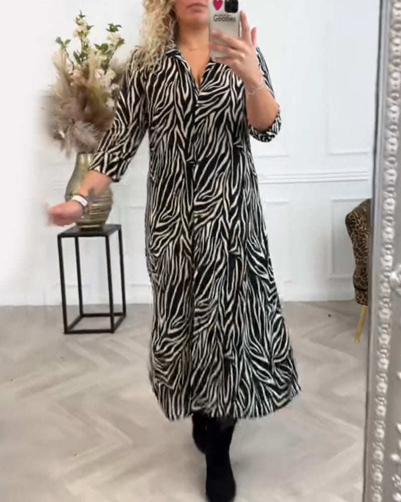 Zwarte zure jurk met zebraprint en revers elegant