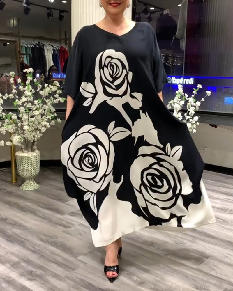 Zwarte jurk met rozenprint elegant design