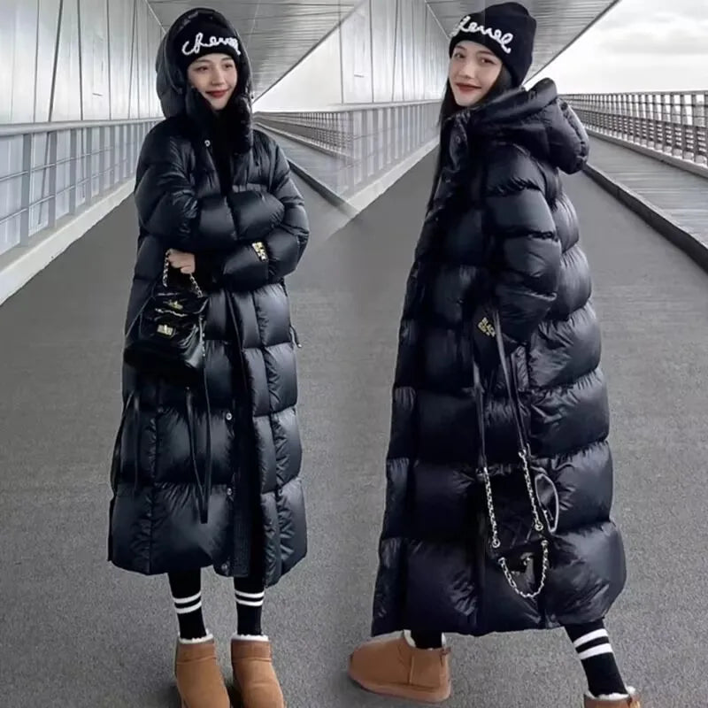 Zwarte dames winterparka met capuchon waterdicht elegant