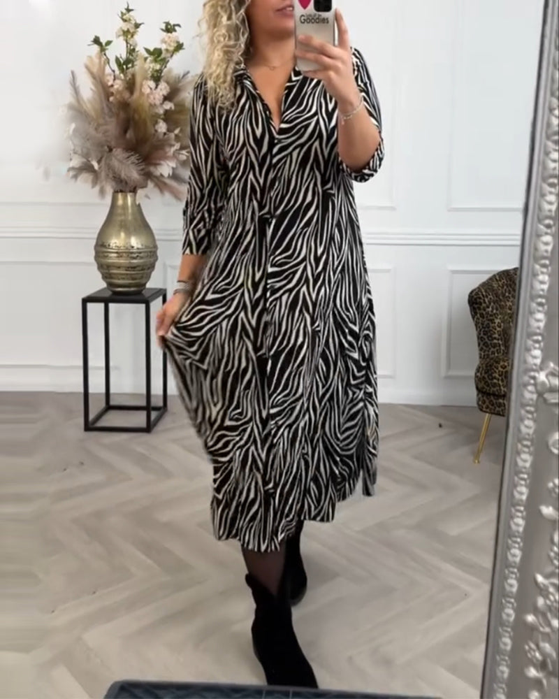Zwarte zure jurk met zebraprint en revers elegant