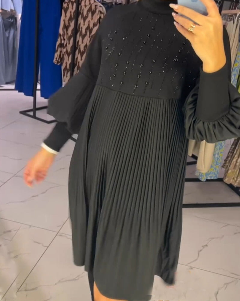 Zwarte jurk met ballonmouwen en opstaande kraag elegant
