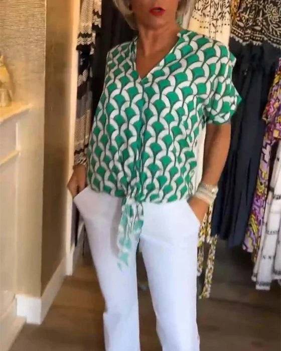 Zure top met print en V-hals voor een frisse look