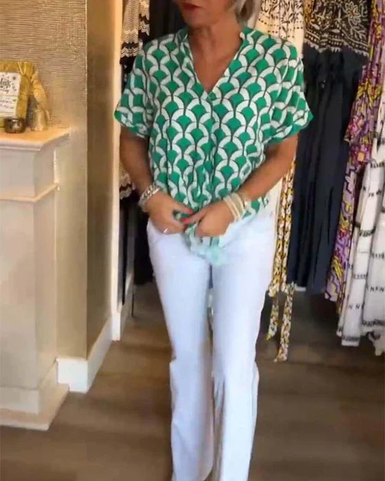 Zure top met print en V-hals voor een frisse look