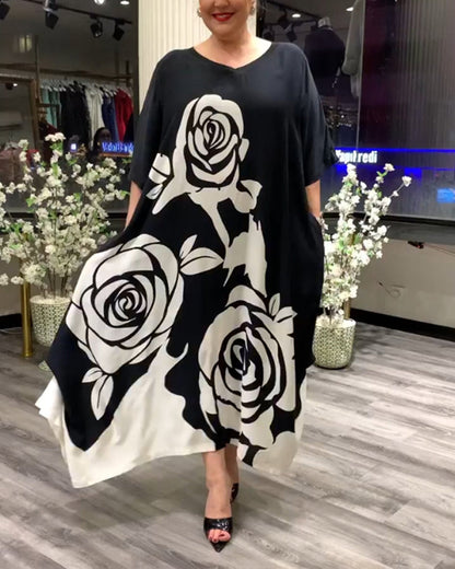 Zwarte jurk met rozenprint elegant design