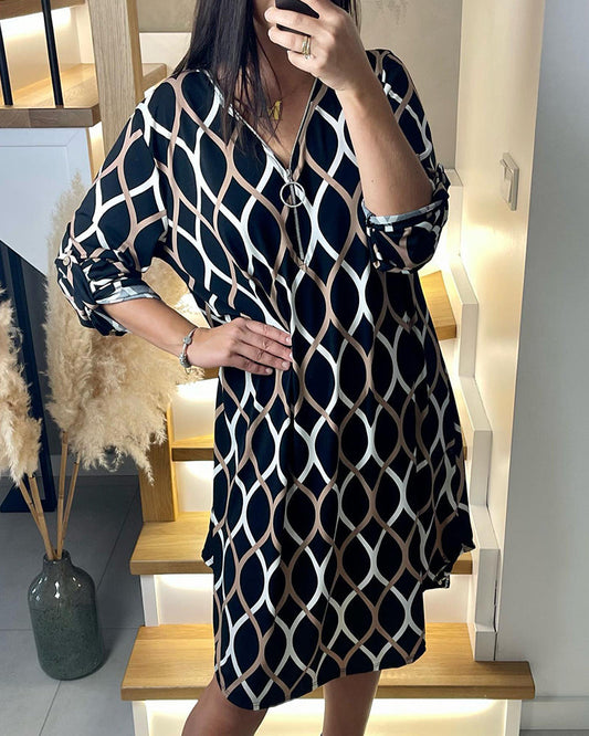 Zwarte jurk met rits en ruitpatroon elegant design