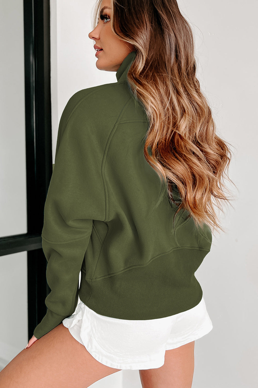 Stijlvolle Bruine Sweatshirt met Rits, Opstaande Kraag en Duimgaten – Perfect voor Casual Comfort