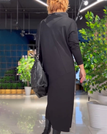 Zwarte jurk met hoge kraag en zakken elegant design