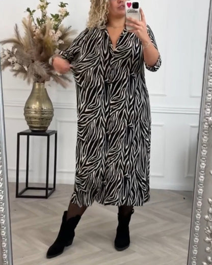 Zwarte zure jurk met zebraprint en revers elegant