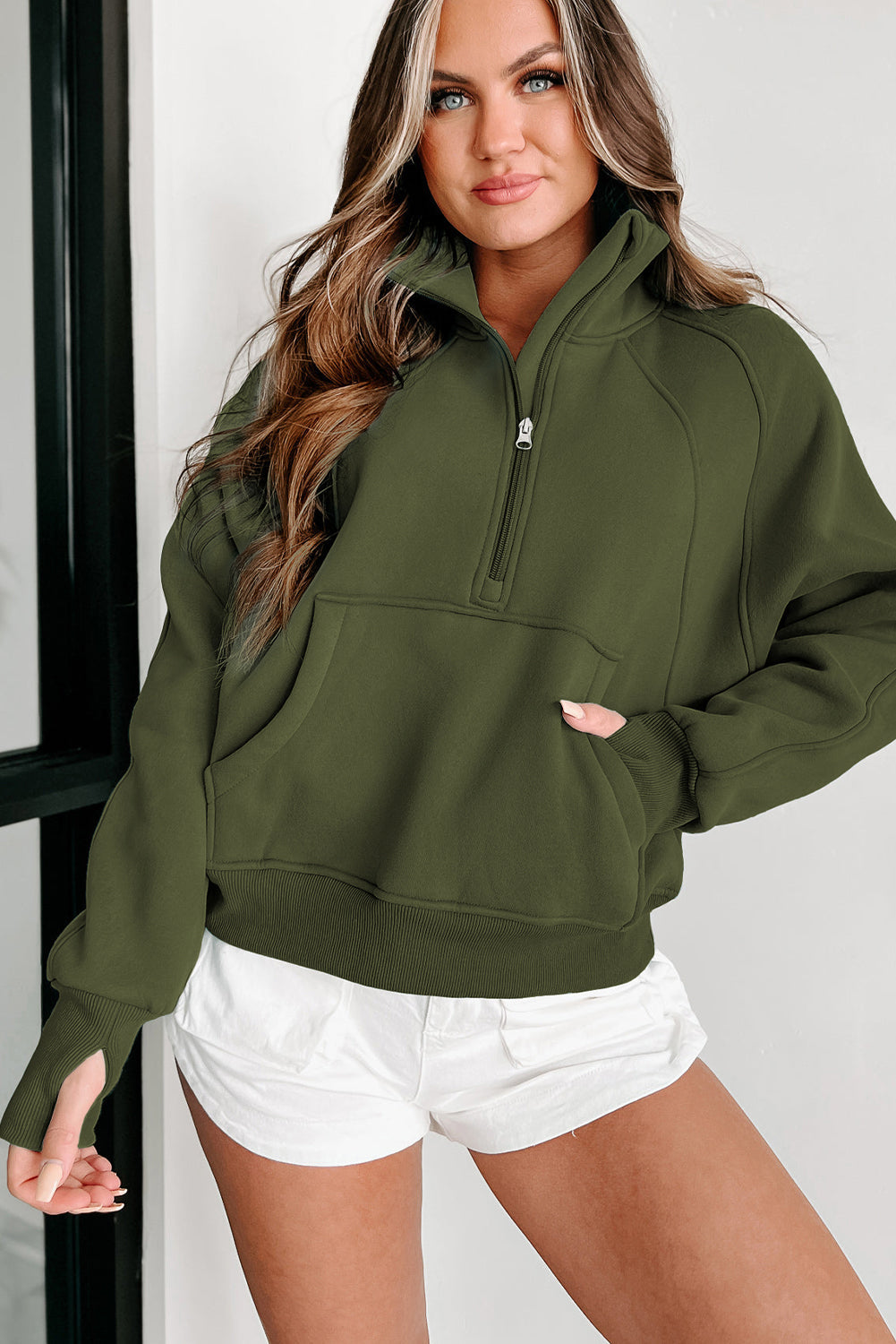 Stijlvolle Bruine Sweatshirt met Rits, Opstaande Kraag en Duimgaten – Perfect voor Casual Comfort