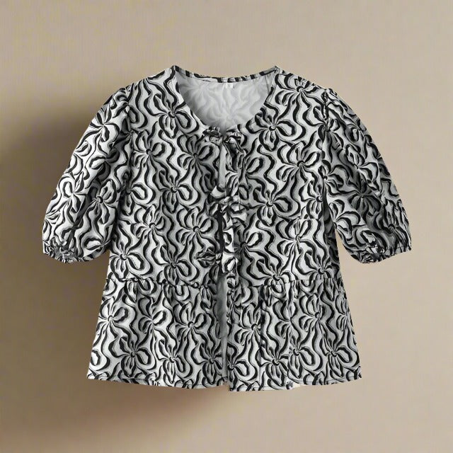 Zomerse katoenen blouse met strik en pofmouwen