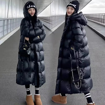 Zwarte dames winterparka met capuchon waterdicht elegant