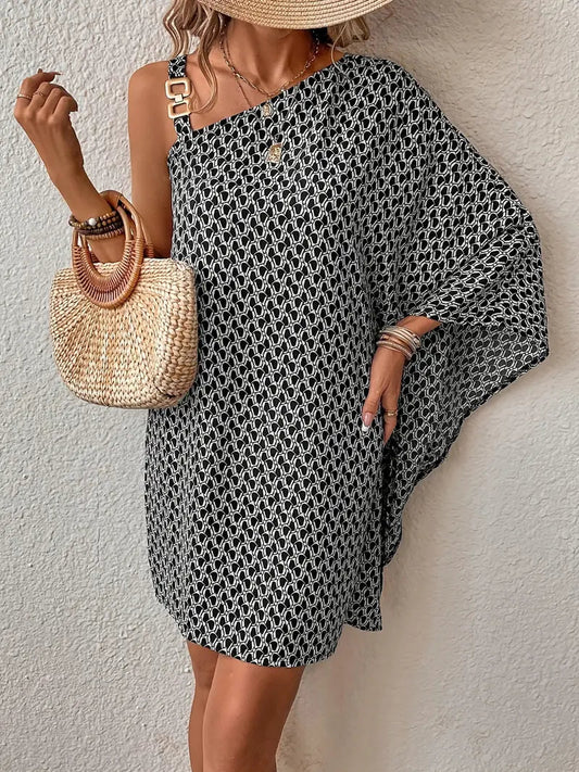 Zwarte jurk met bruine asymmetrische print elegant