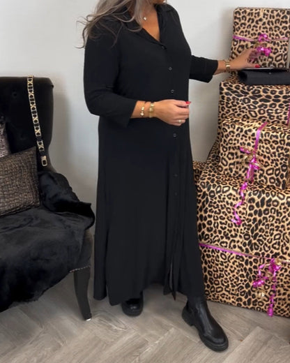 Zwarte jurk met knopen en V-hals elegant design